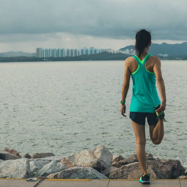 Healthy Lifestyle Woman Runner Stretching Legs Before Running